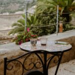 Mosaic table and chair on a sunny balcony