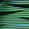 Green wavy lines with shadows creating an abstract pattern.